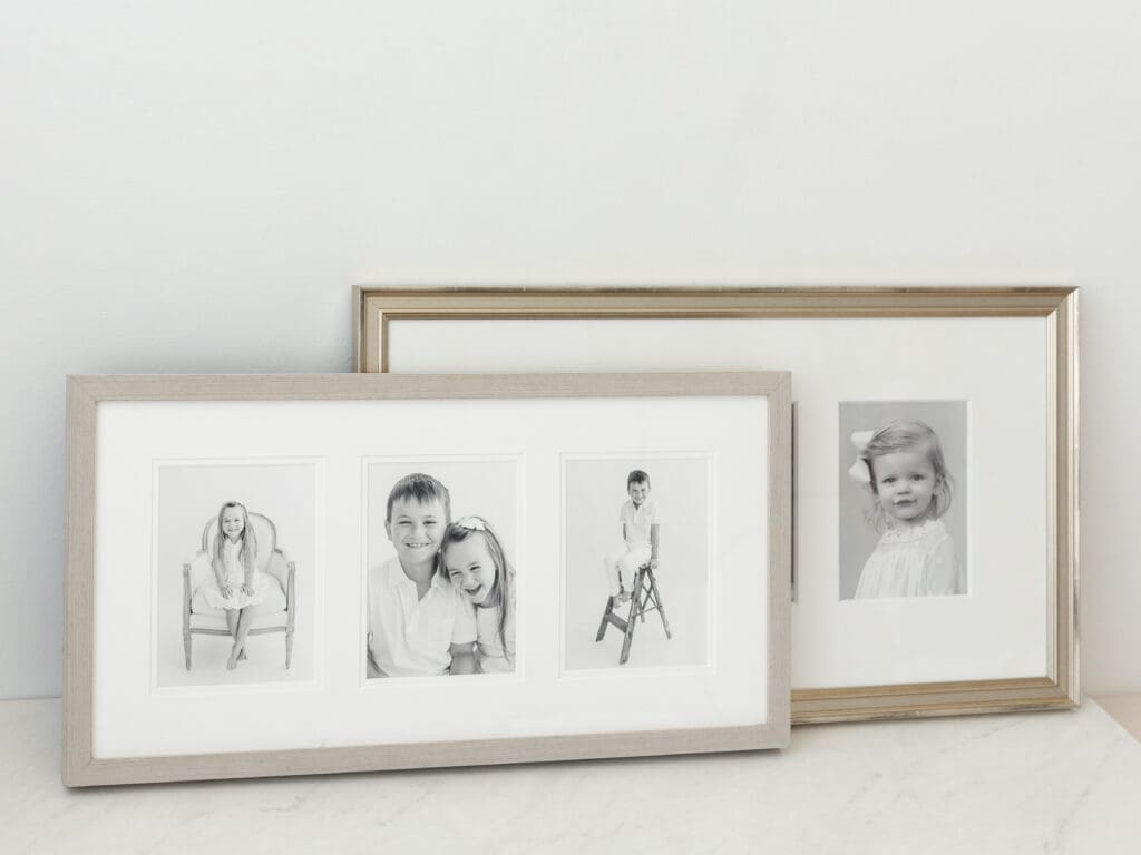 Framed black and white children portraits displayed as custom wall art by Louisville Kentucky newborn photographer