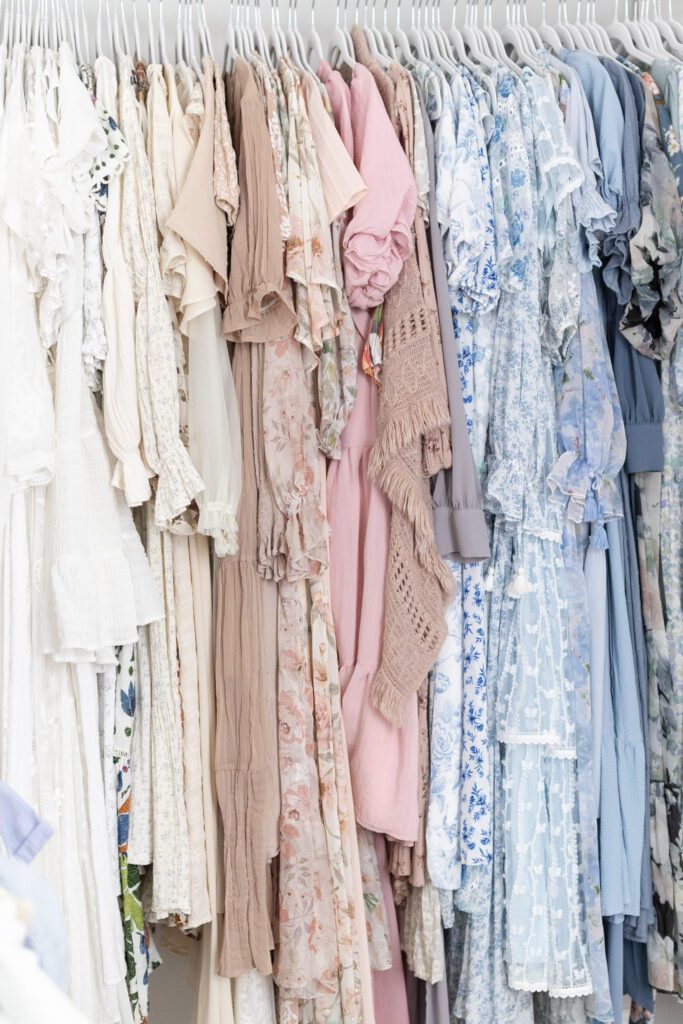 Client wardrobe with neutral and pastel dresses for studio newborn photography sessions in Louisville, KY
