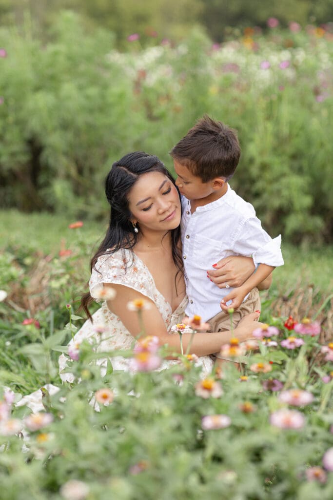 Shelbyville Kentucky maternity photo session with mother and toddler son among summer blooms at Chickapoo Farm